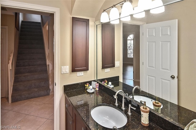 bathroom with tile patterned flooring and vanity