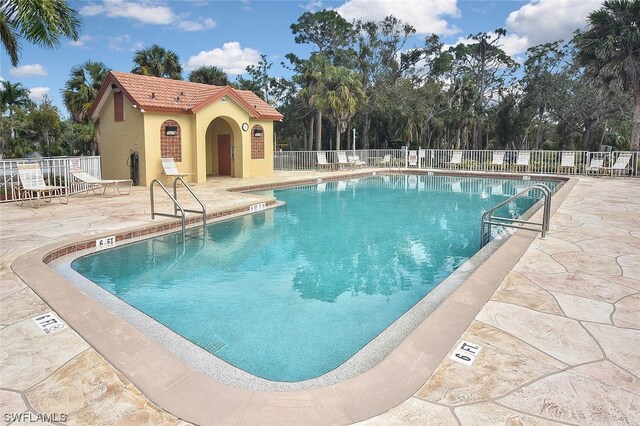 view of swimming pool with a patio area