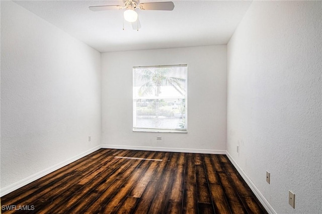 unfurnished room featuring ceiling fan and dark hardwood / wood-style flooring