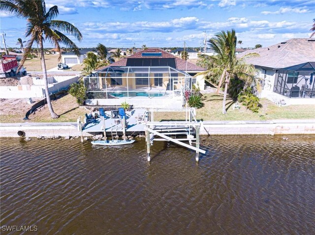 dock area with a water view and a lanai