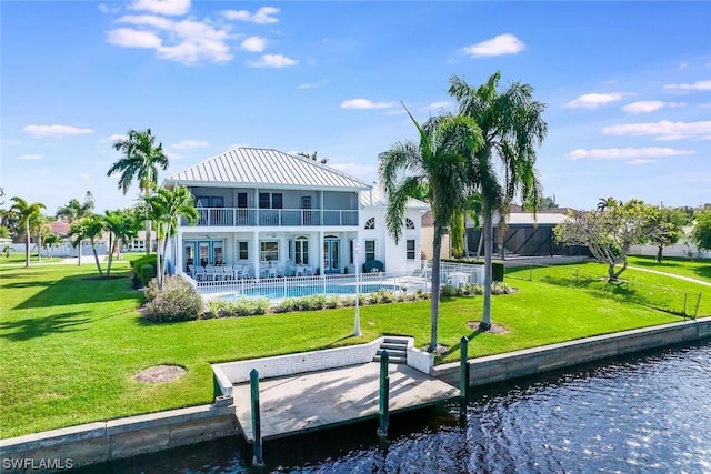 4630 SE 20th Ave, Cape Coral, FL 33904 - rear view of house with a lawn, a balcony, and a water view