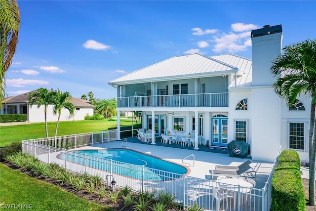 4630 SE 20th Ave, Cape Coral, FL 33904 - view of swimming pool featuring french doors, a yard, and a patio area