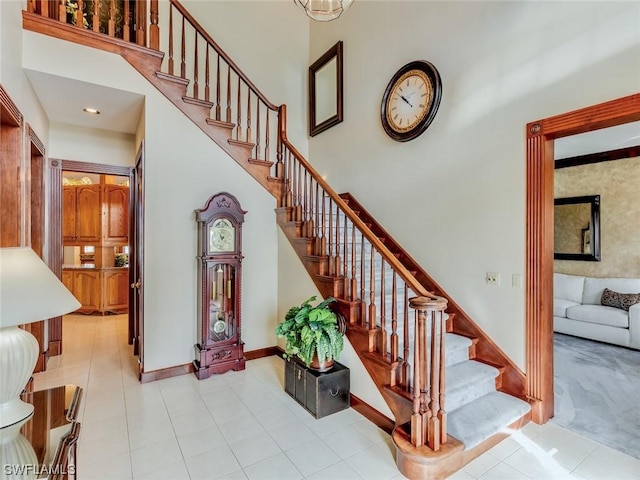 4630 SE 20th Ave, Cape Coral, FL 33904 - staircase with a high ceiling and tile patterned flooring