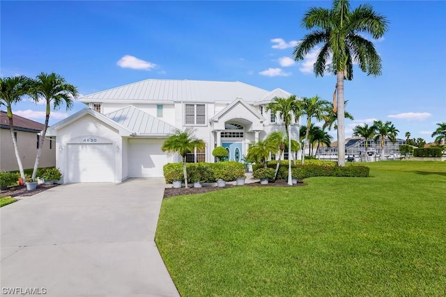 4630 SE 20th Ave, Cape Coral, FL 33904 - view of front of home with a garage and a front lawn