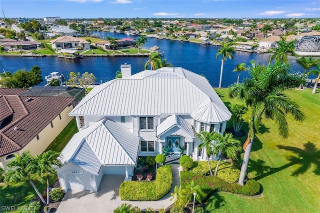 birds eye view of property featuring a water view