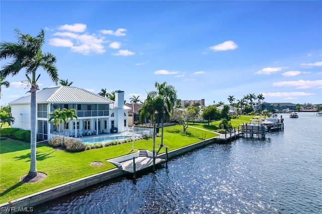 4630 SE 20th Ave, Cape Coral, FL 33904 - view of community featuring a yard, a swimming pool, and a water view