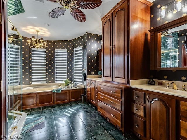 4630 SE 20th Ave, Cape Coral, FL 33904 - bathroom featuring vanity, tile patterned flooring, ceiling fan with notable chandelier, and a tub