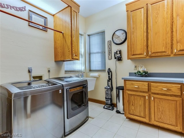 4630 SE 20th Ave, Cape Coral, FL 33904 - washroom with cabinets, washer and clothes dryer, sink, and light tile patterned floors