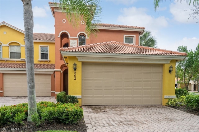 mediterranean / spanish-style home featuring a garage