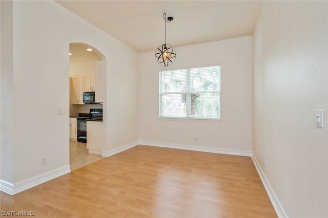 spare room featuring light hardwood / wood-style flooring