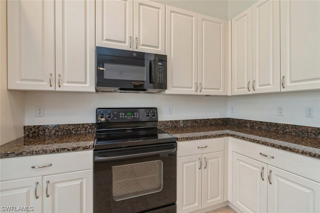 kitchen featuring white cabinets, black appliances, and dark stone counters