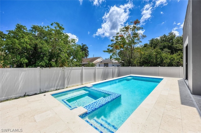 view of swimming pool with an in ground hot tub and a patio area