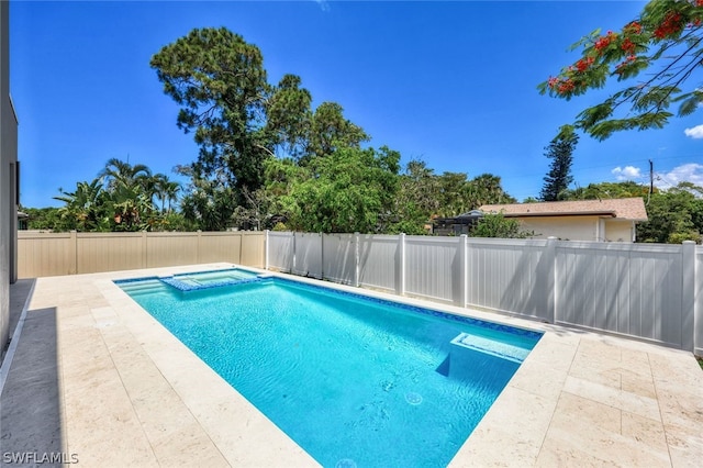 view of pool featuring an in ground hot tub and a patio area