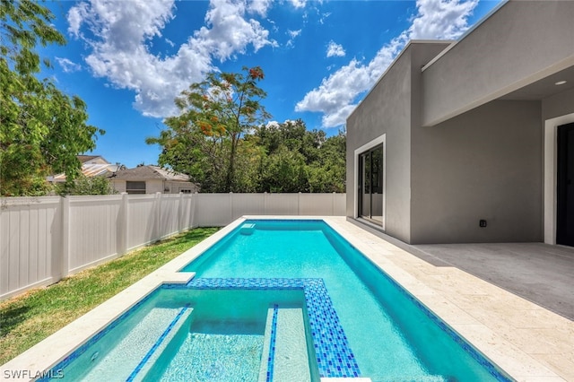 view of pool featuring a patio