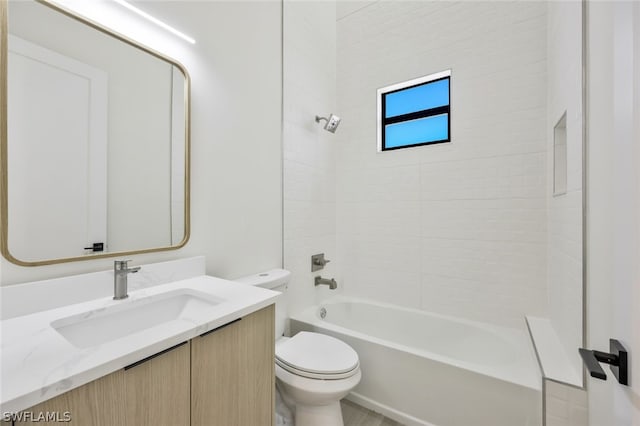 full bathroom with vanity, toilet, and tiled shower / bath