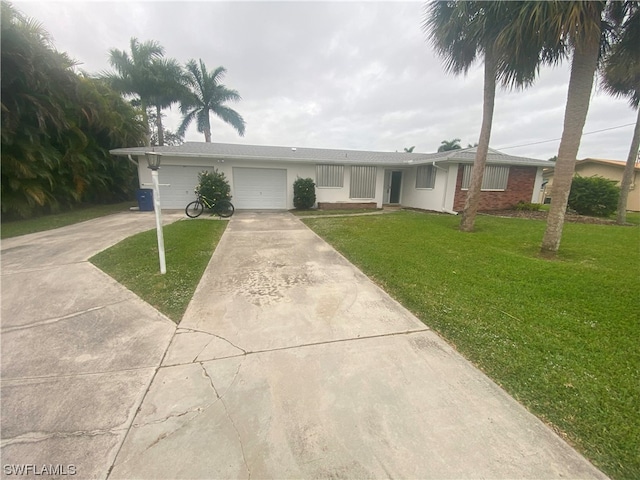 ranch-style house with a front yard and a garage