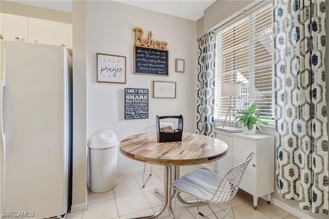 dining room featuring light tile patterned floors