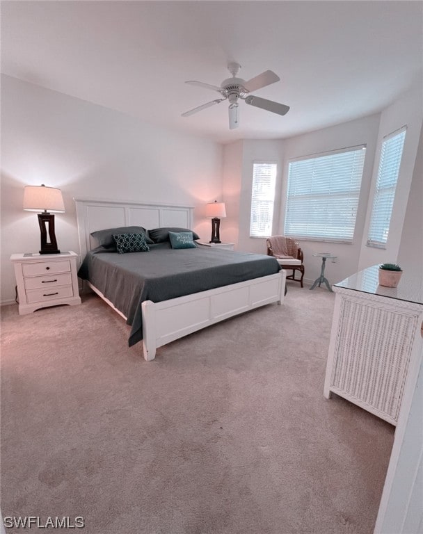 carpeted bedroom featuring ceiling fan