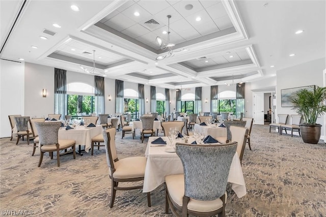 dining area featuring carpet floors, a chandelier, and coffered ceiling