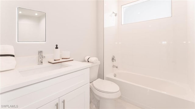 full bathroom with toilet, tiled shower / bath, and vanity