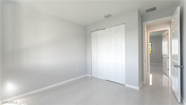 unfurnished bedroom featuring a closet