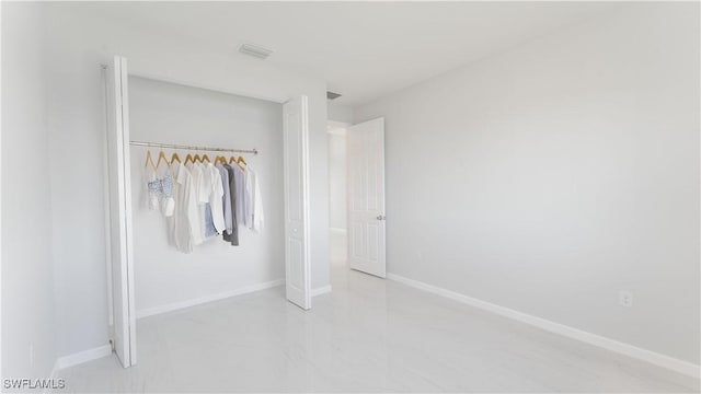 unfurnished bedroom with a closet