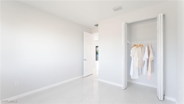 unfurnished bedroom featuring a closet