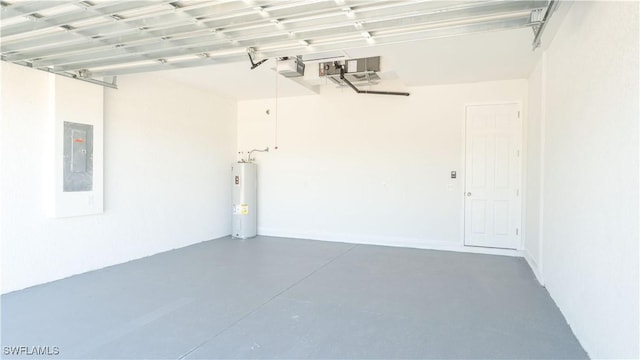 garage featuring electric panel, water heater, and a garage door opener