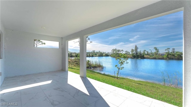 view of patio featuring a water view