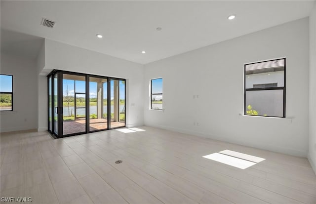 spare room featuring plenty of natural light