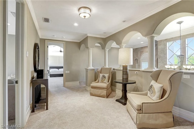 sitting room with crown molding and light colored carpet