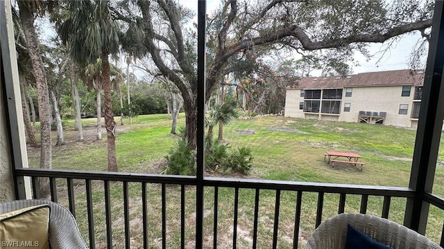 view of yard featuring a balcony