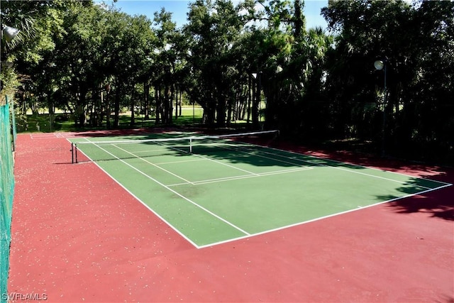 view of sport court featuring basketball hoop