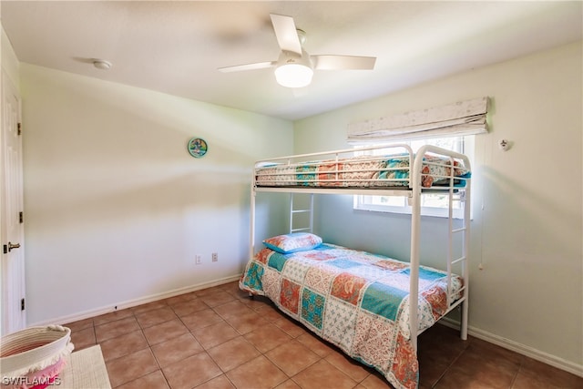 bedroom featuring ceiling fan and tile patterned flooring