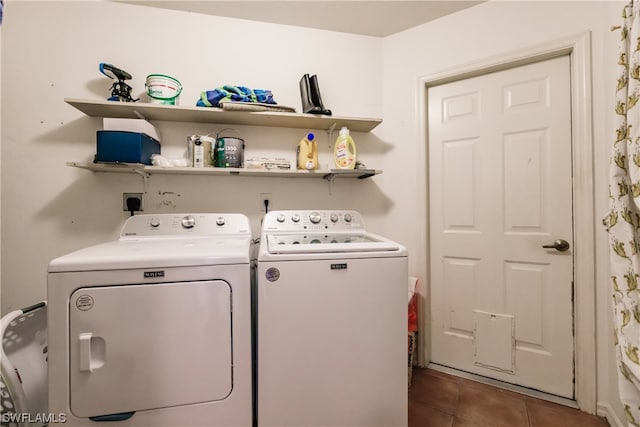 laundry area with washer and dryer and tile patterned floors