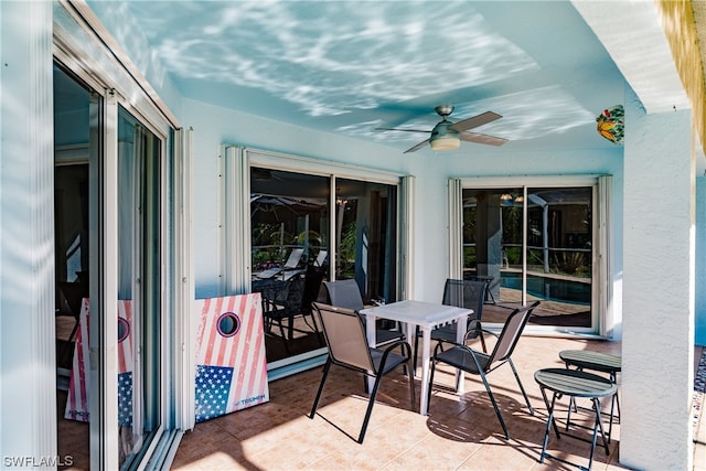 exterior space featuring ceiling fan