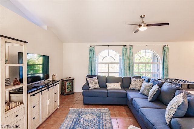 tiled living room with lofted ceiling and ceiling fan