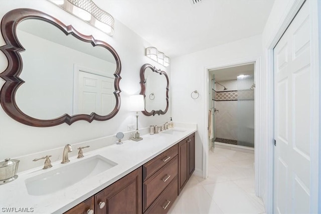 bathroom with vanity and tile patterned flooring