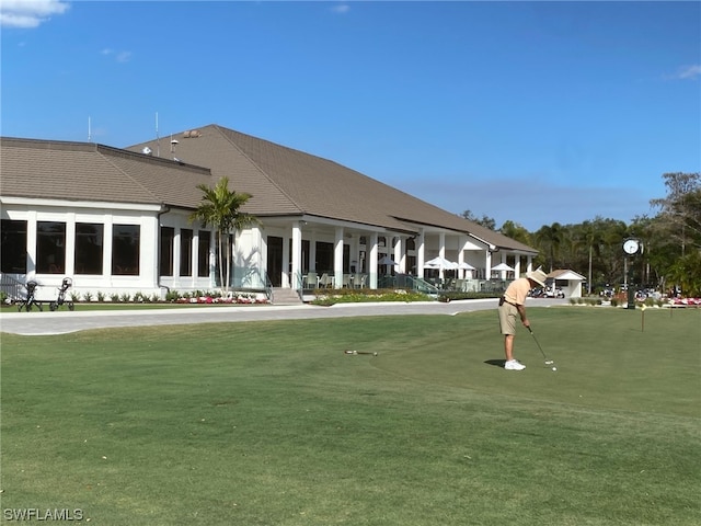 view of property's community with a lawn