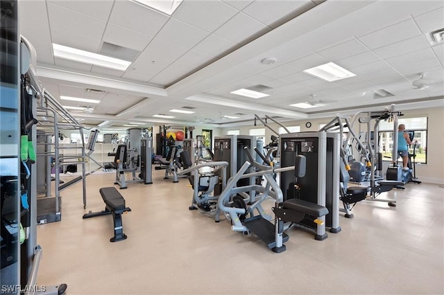 workout area with a paneled ceiling