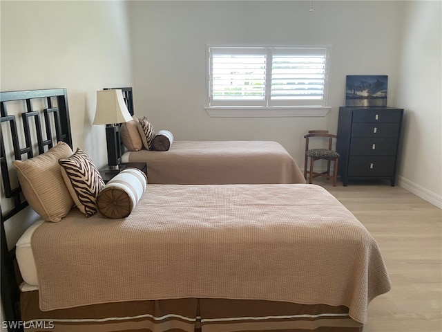 bedroom with light hardwood / wood-style floors