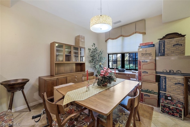 dining room featuring light tile floors