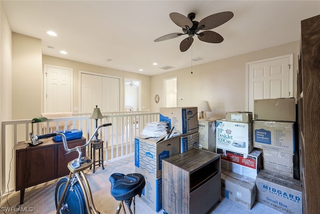 misc room featuring dark colored carpet and ceiling fan