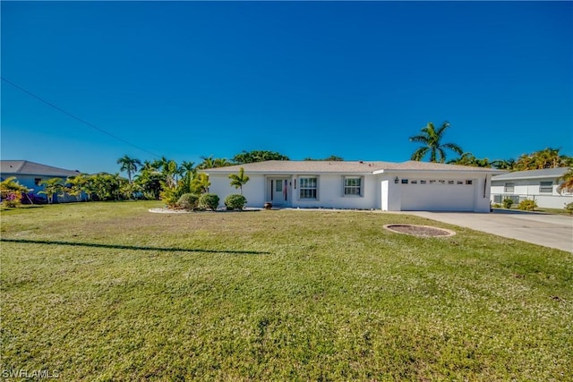 ranch-style home with a garage and a front lawn