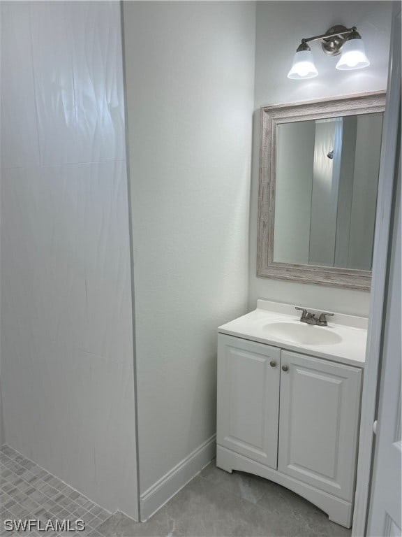 bathroom featuring vanity and tile floors