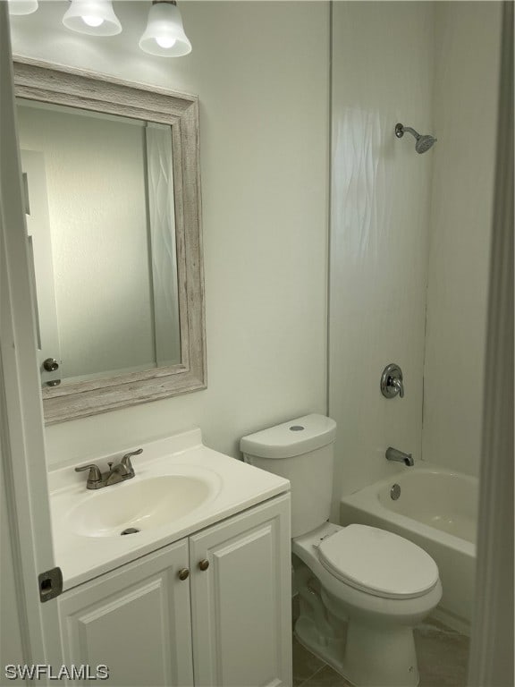 full bathroom featuring vanity, tile flooring, bathtub / shower combination, and toilet