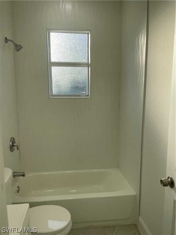 full bathroom with toilet, tiled shower / bath combo, and vanity