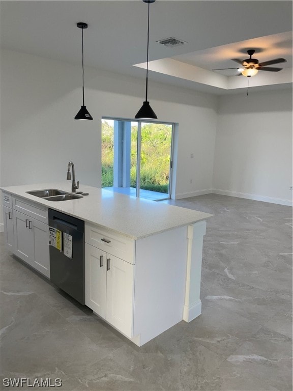 kitchen featuring pendant lighting, black dishwasher, white cabinets, and sink