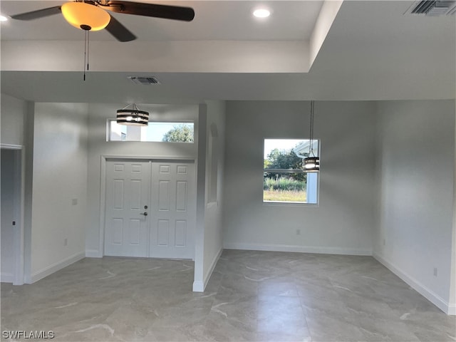 tiled entryway with ceiling fan