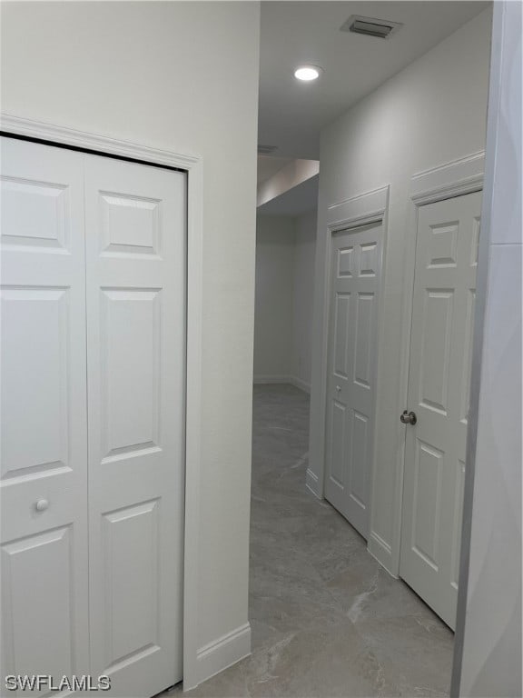 hallway featuring light tile floors